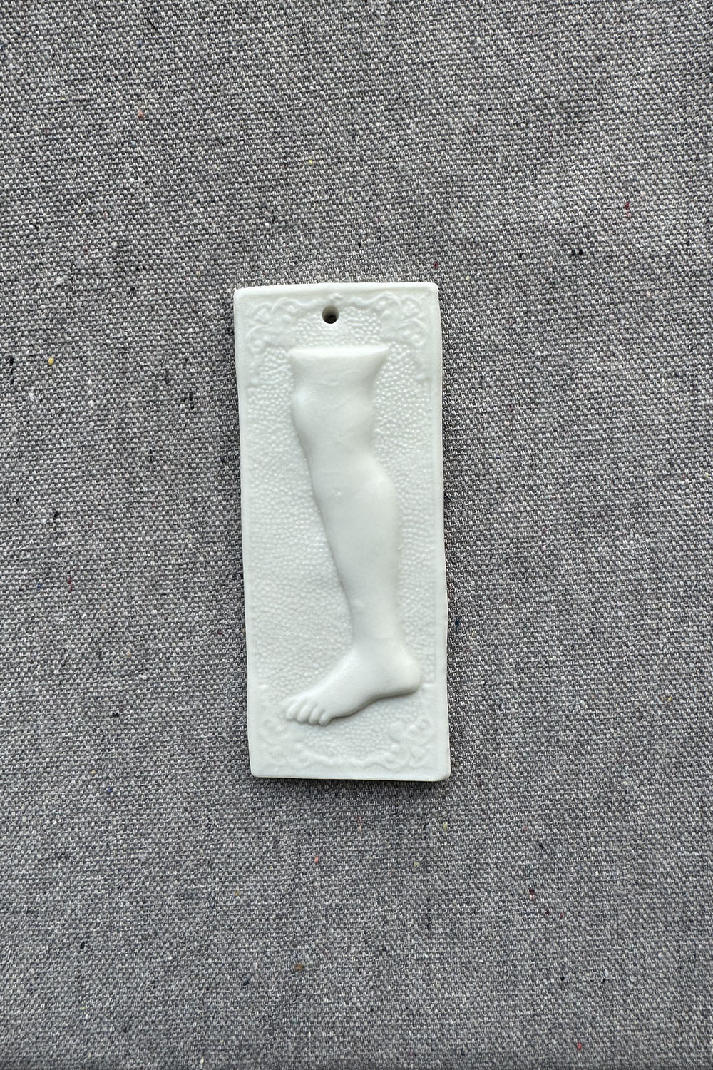ceramic wall ornament - sq foot